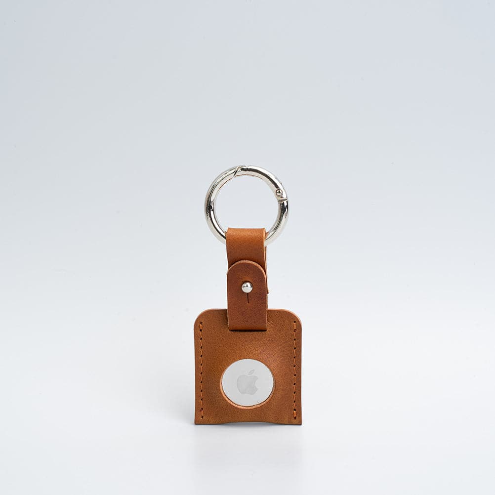 tan airtag keyring with silver carabiner