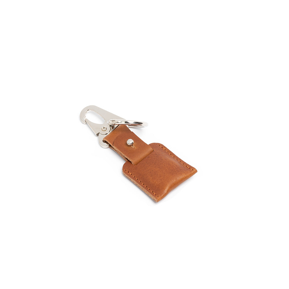 tan leather airtag keychain on carabiner