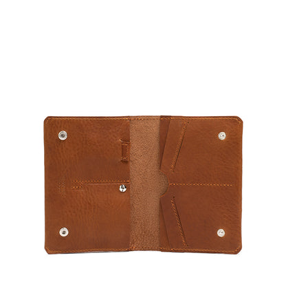 Image of a tan leather AirTag passport wallet for both men and women, crafted by Geometric Goods. With a secret slot for AirTag and passport. Made from premium Italian leather.