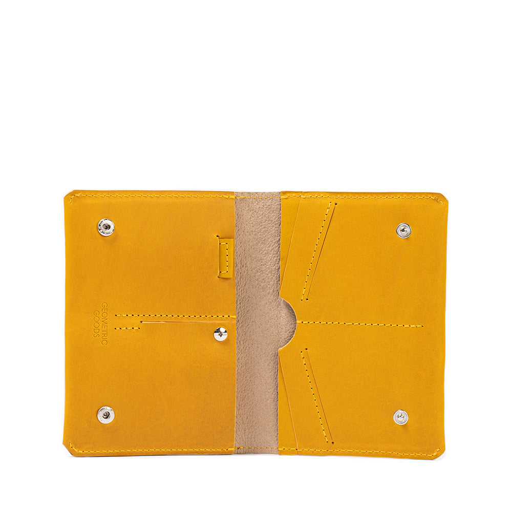 Image of stylish AirTag travel passport wallets handcrafted be Geometric Goods in Europe for U.S. from premium Italian leather in yellow color